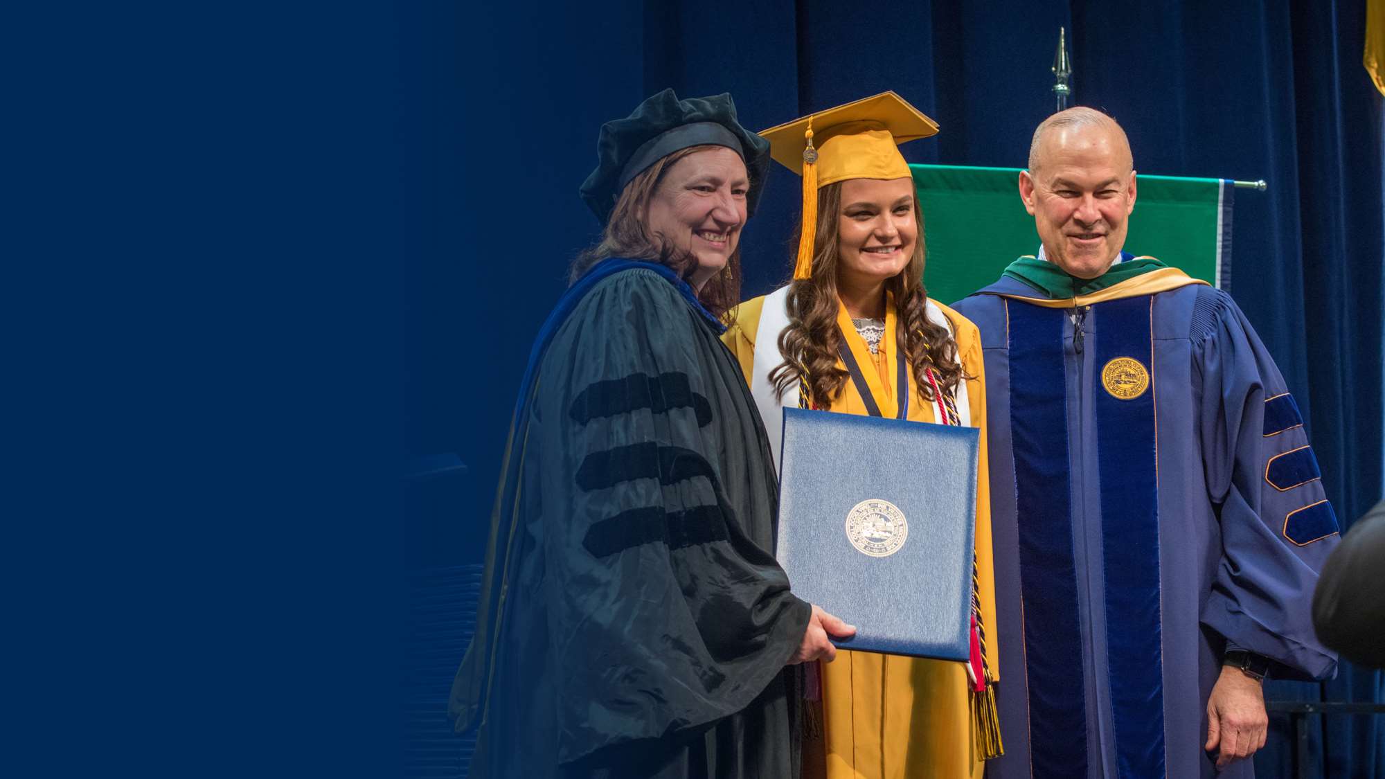 Photo of a graduate at commencement