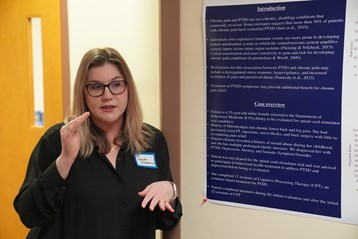Eastern Campus medical student presents her poster at the annual research symposium