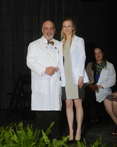 Photo of Kathryn Baker receiving her white coat.