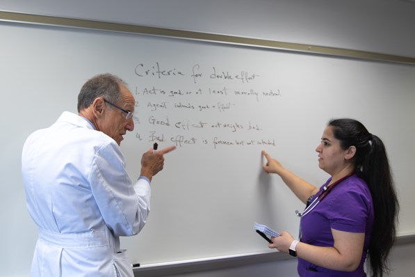 Doctor teaching fellow during lecture