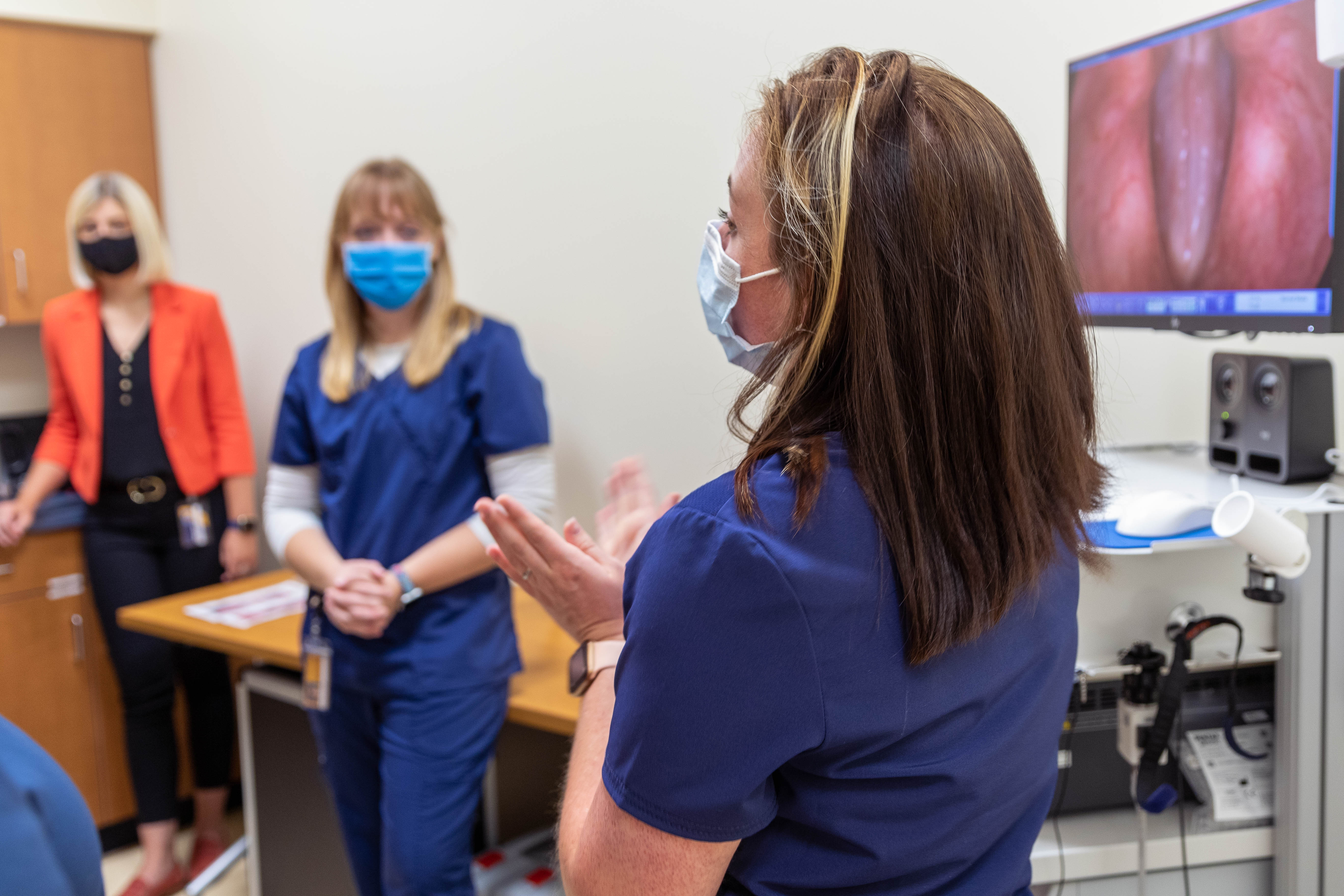 Students demonstrate equipment in the WVU Speech, Language, and Hearing Clinic