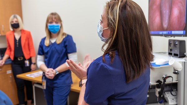 Students demonstrate equipment in the WVU Speech, Language, and Hearing Clinic