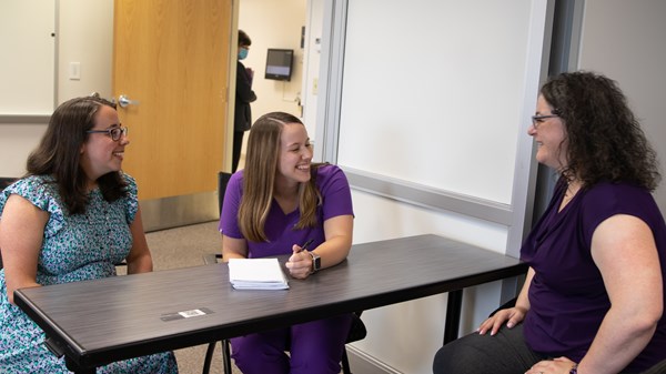 Hospice and Palliative Medicine staff talking to each other