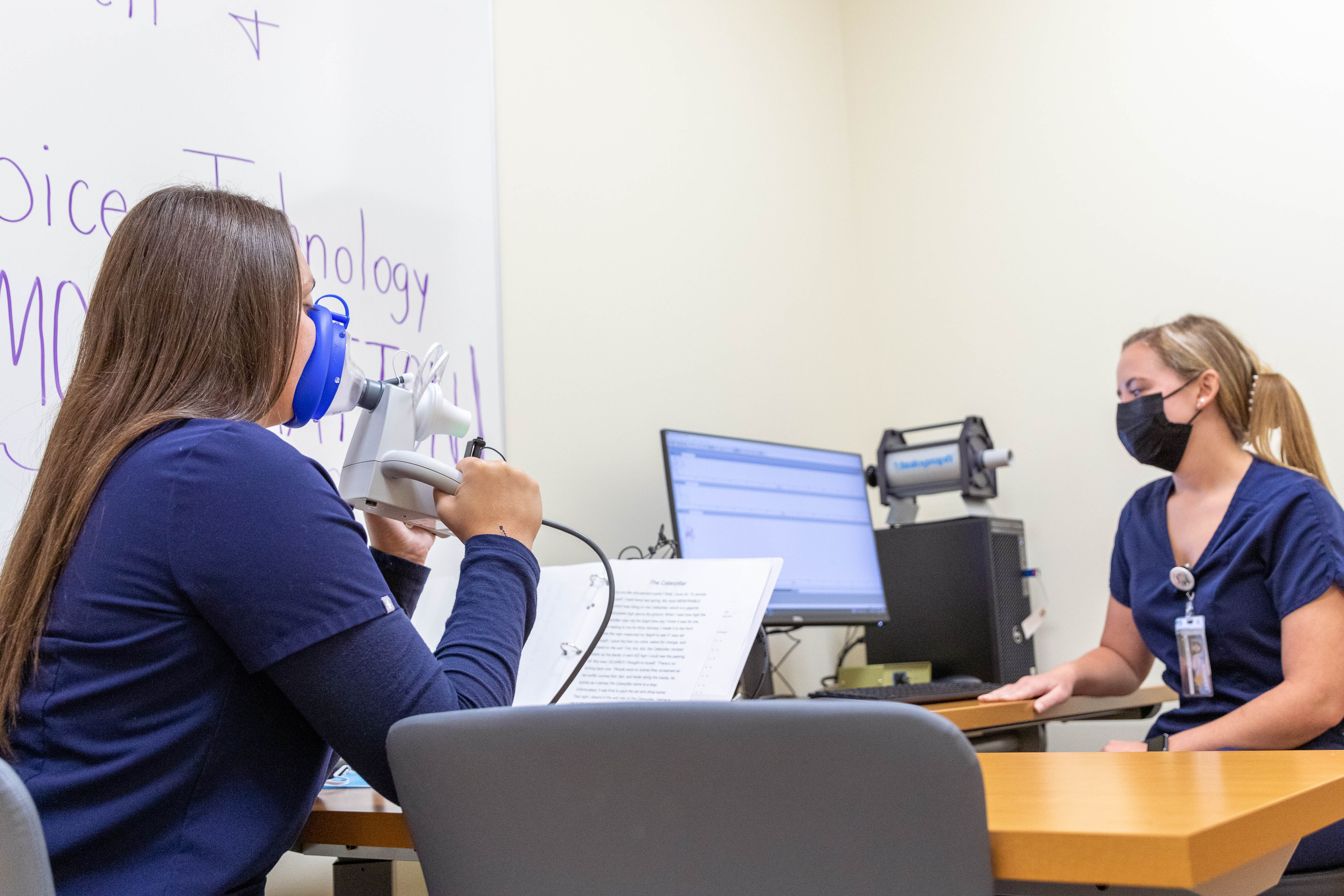 Students demonstrate equipment in the WVU Speech, Language, and Hearing Clinic