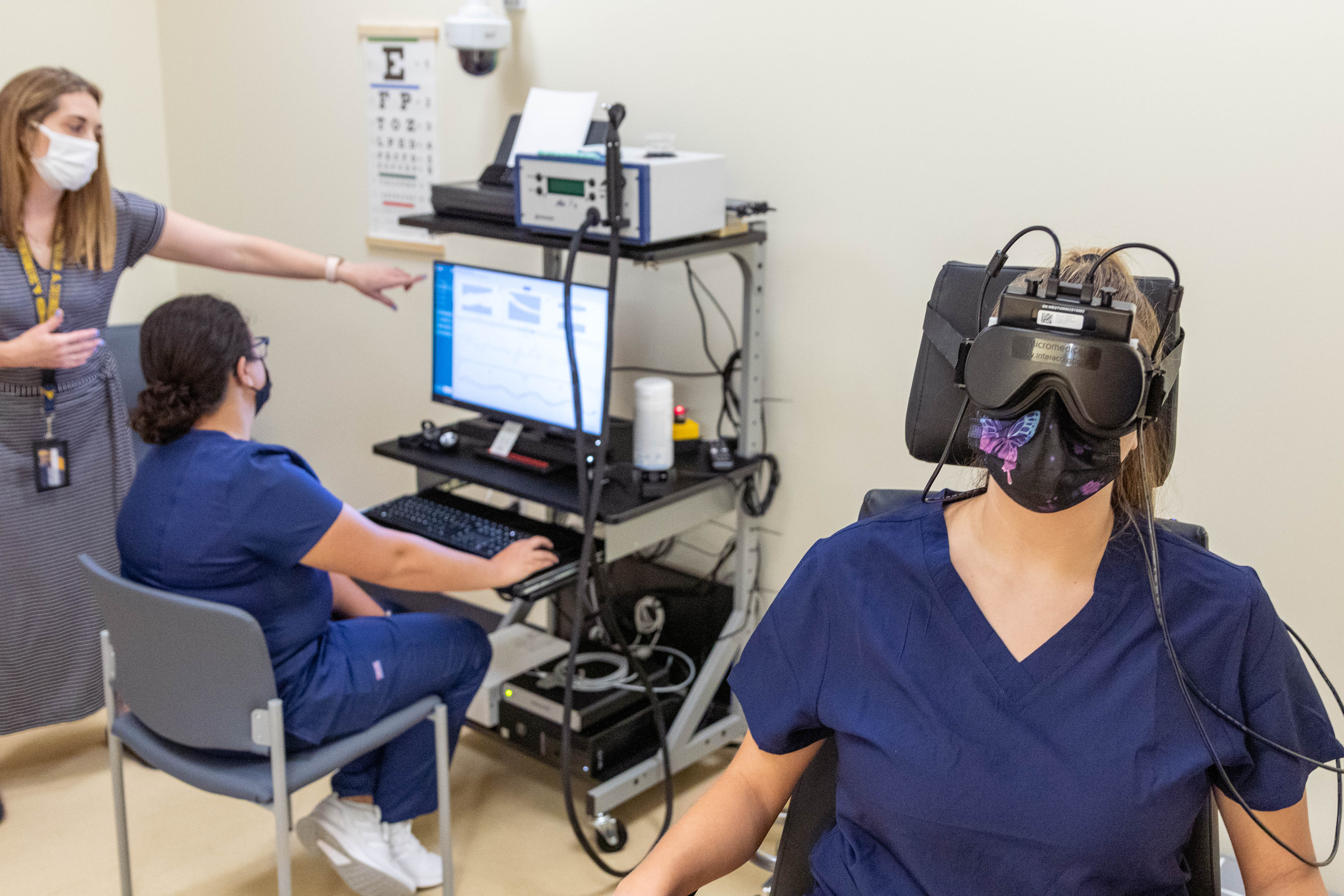 Students and faculty demonstrate equipment in the WVU Speech, Language, and Hearing Clinic
