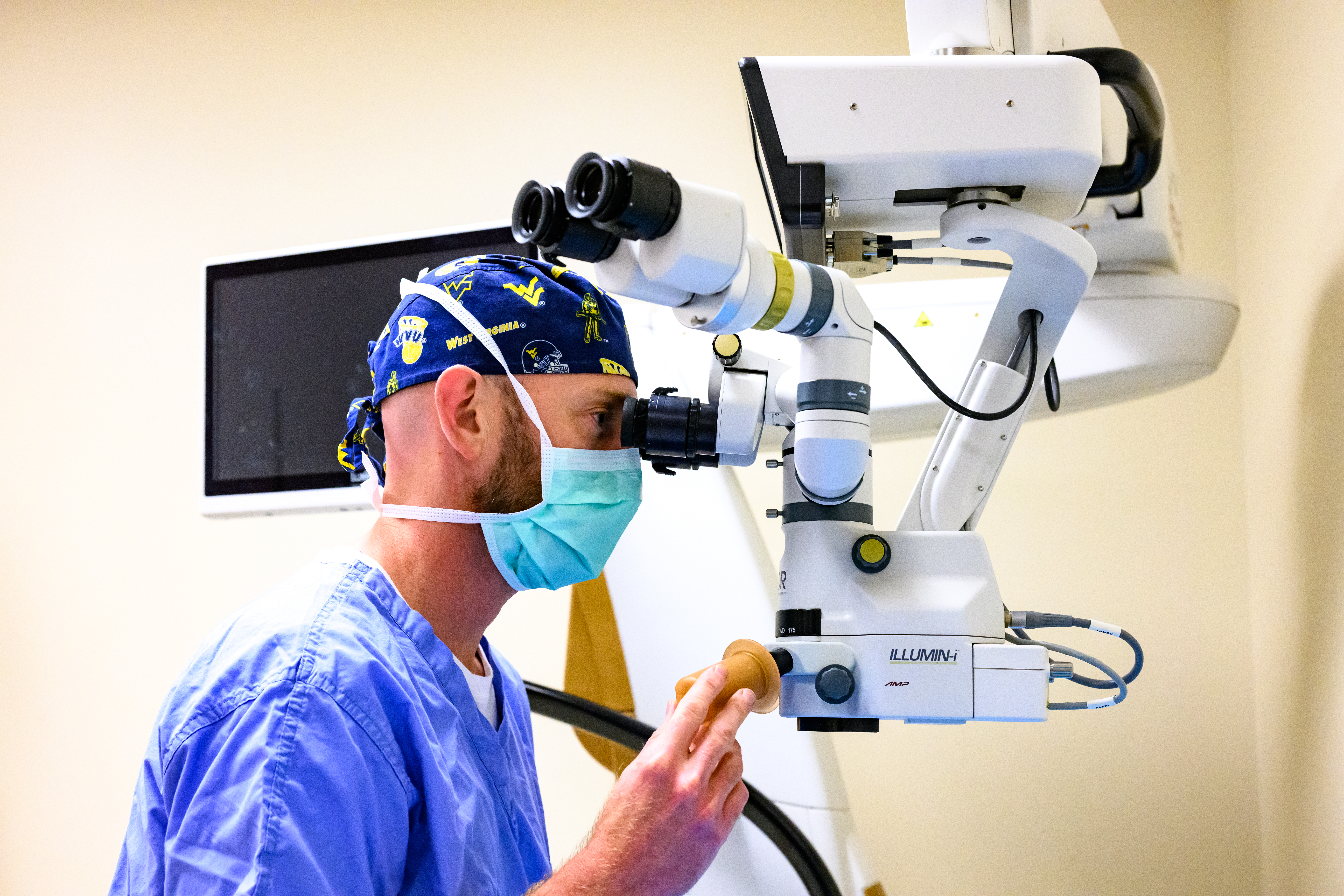 Glaucoma specialist Brian McMillan utilizes surgical microscope