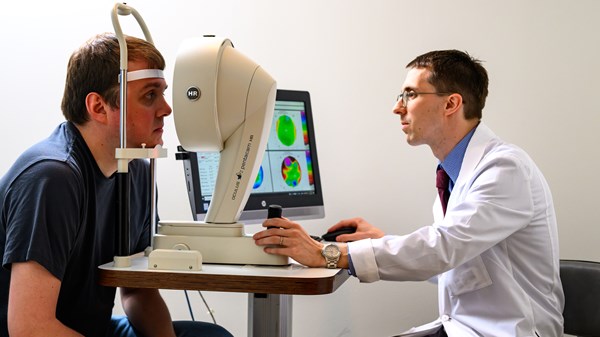 Cornea specialist Evan Frigoletto, M.D. provides care for a patient