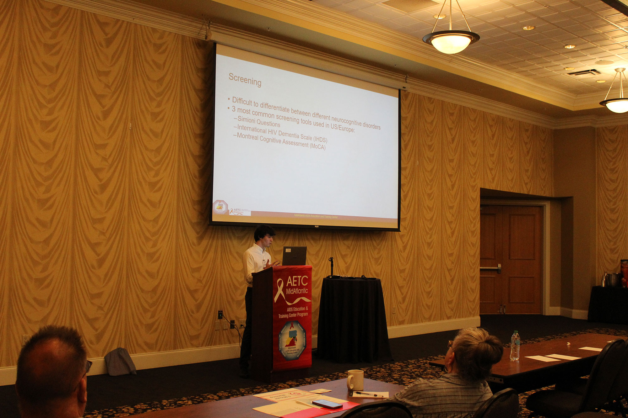 Mid altlantic conference room with a central podium and attendees