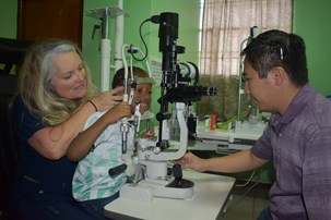 Director of Outreach Rebecca Coakley and Professor John Nguyen perform an evaluation on a pediatric patient through Kids Insight in Saint Lucia